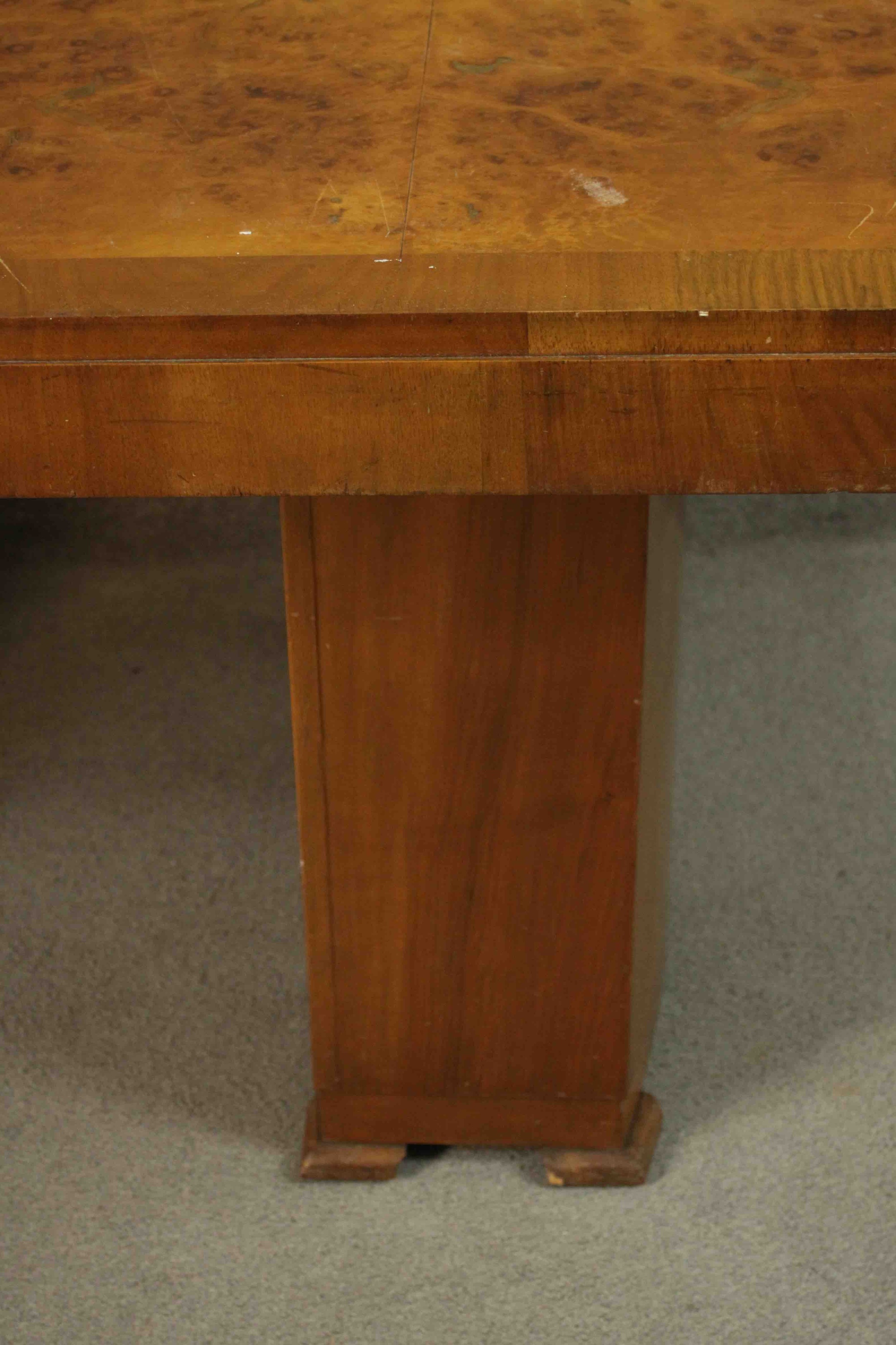 An Art Deco burr walnut and crossbanded dining table with rounded rectangular top on twin pillar - Image 7 of 9