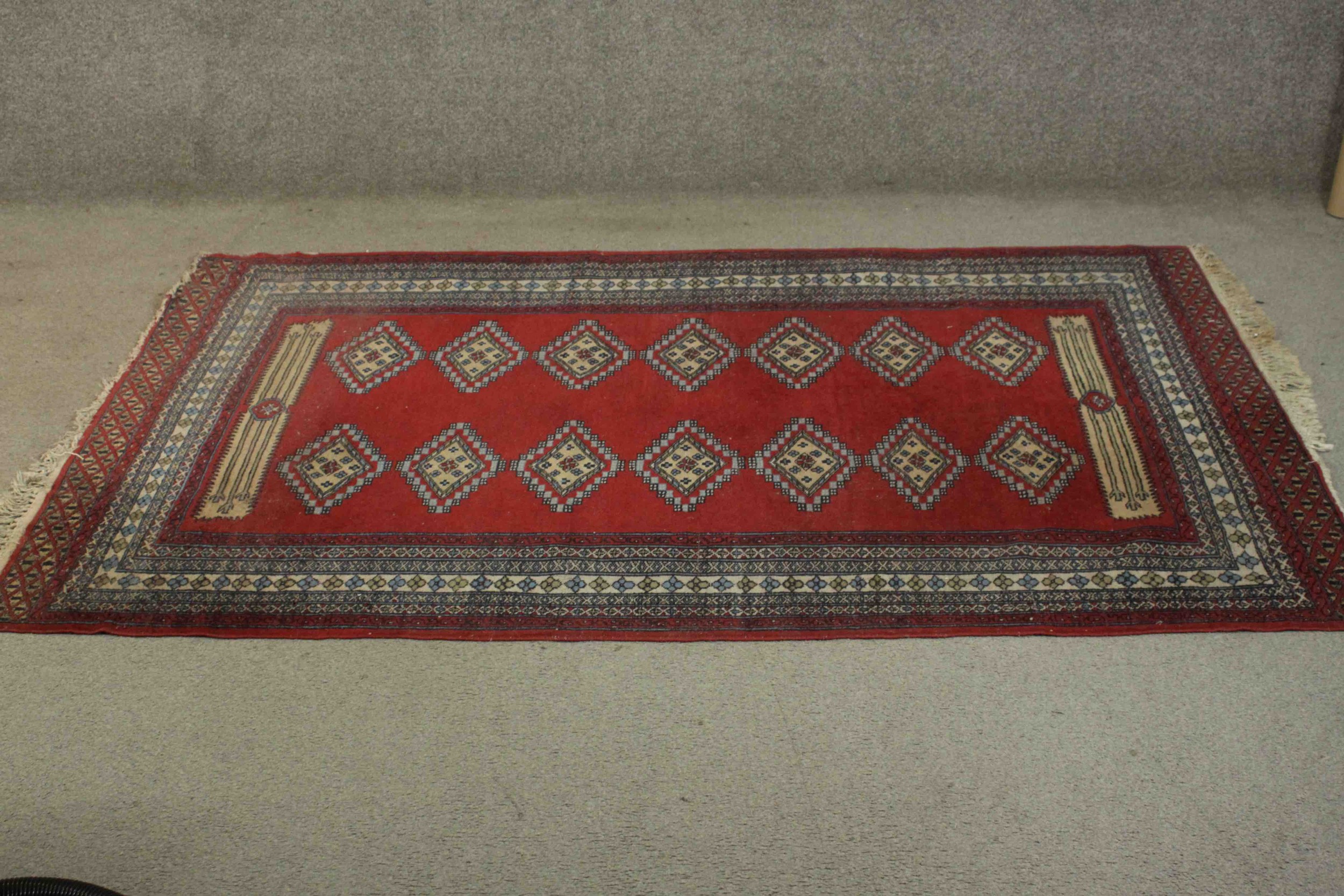 A Pakistan Bokhara with repeating diamond motifs on a burgundy field within stylised flowerhead - Image 2 of 6