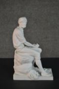 A Parian ware style ceramic figure of a seated man with woven baskets. Stamped VA to base. H.27 W.17