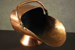 A large and small Victorian copper coal scuttle with brass handles. H.45 W.48 D.36cm.