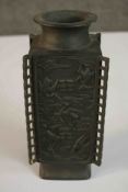 An Oriental bronze rectangular vase with relief stork and cloud design, character mark to base. H.21