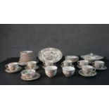 A Johnson Brothers Indian Tree pattern eight person part dinner service. Includes seven tea cups and