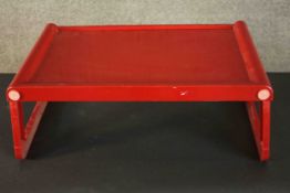 A red acrylic Guzzini folding tray, Jolly, designed by Luigi Massoni, Italy. Makers label to base.