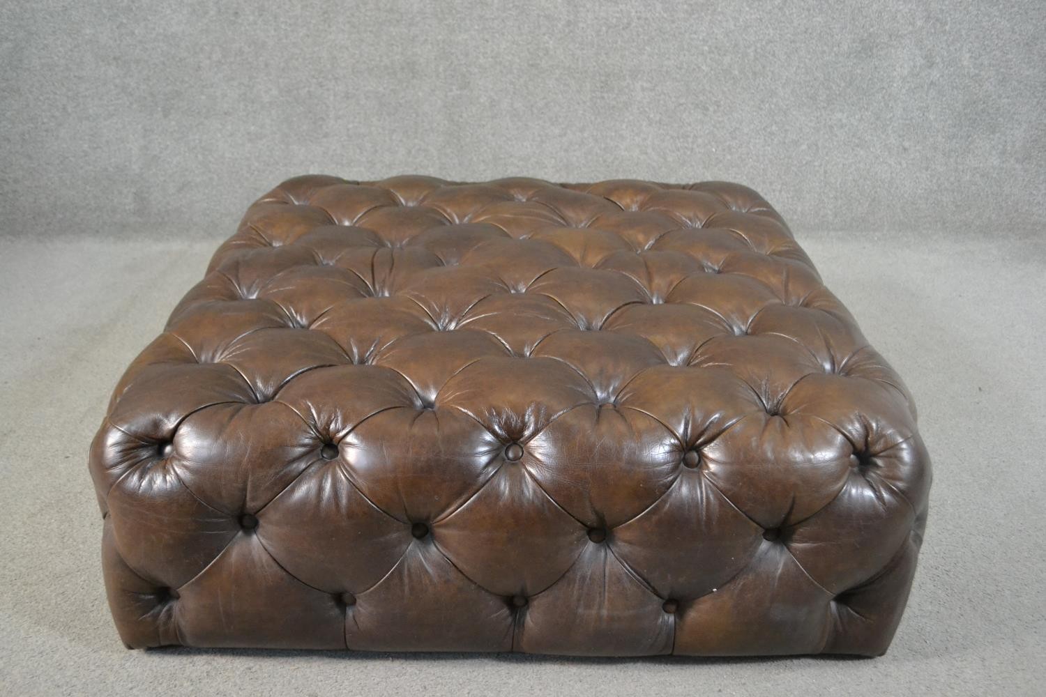 A contemporary brown deep buttoned leather hearth stool. H.33 W.100 D.100cm - Image 2 of 4