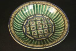 An early 20th century large Qajar green and blue geometric design ceramic bowl. H.10 Dia.36cm.