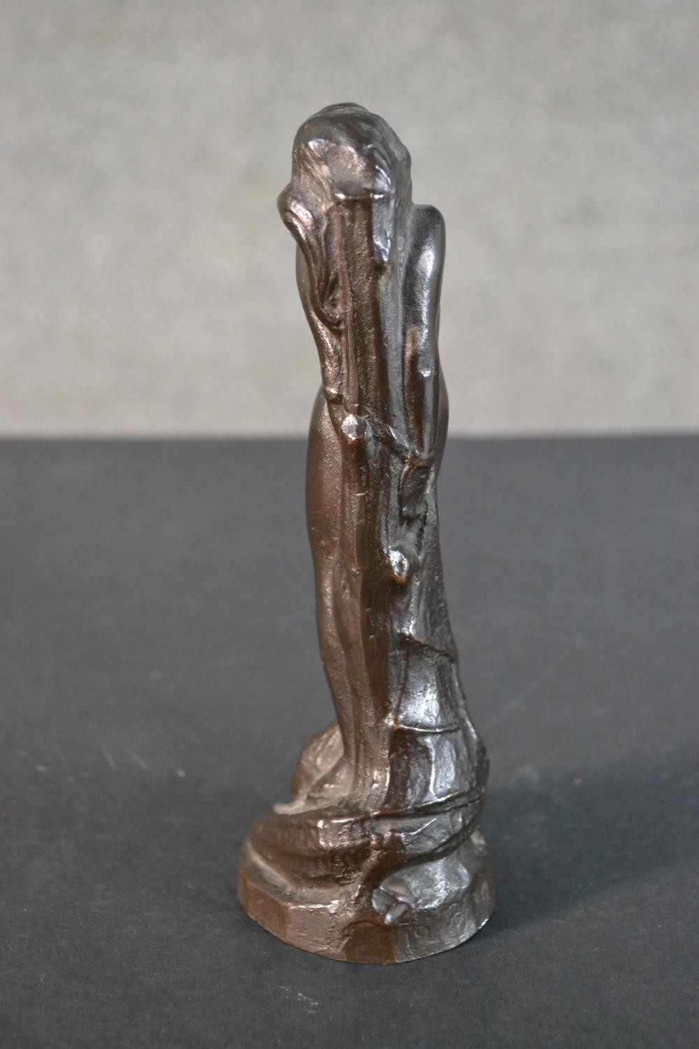A 20th century bronze figurine of a nude woman tied at a stake with dragon at her feet. Dated - Image 4 of 8