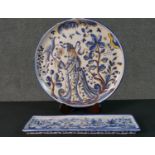 A FCA Sant'Anna Portuguese hand painted ceramic charger with a lady and a bird in the garden along