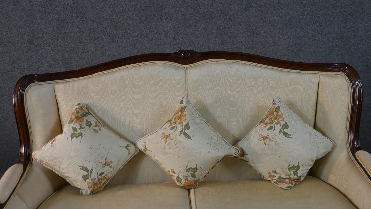 A late 20th century French show wood two seater sofa, with a carved frame, upholstered in cream - Image 4 of 7