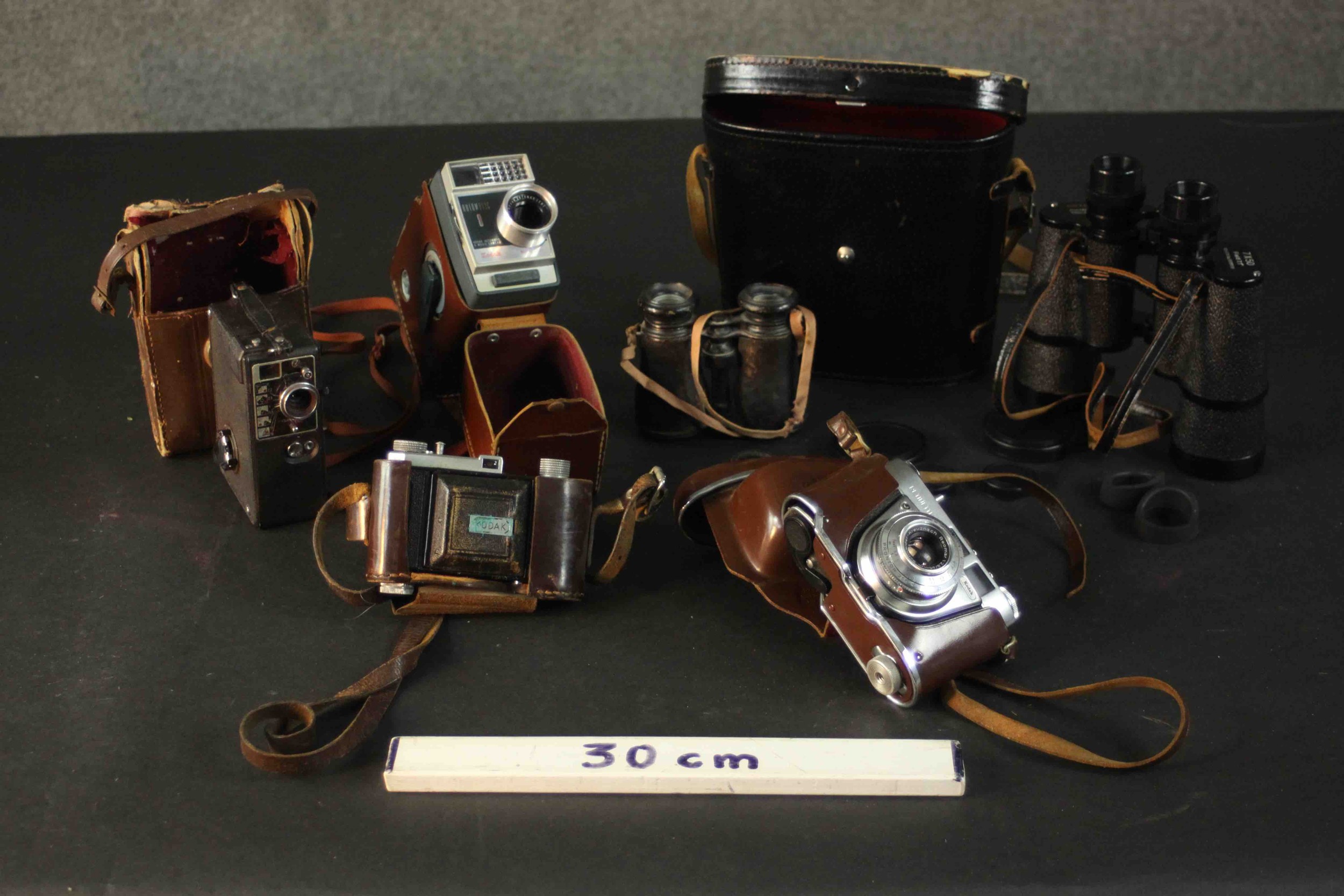 A collection of four vintage cameras. A Kodak Retinette 1A, Kodak Automatic 8, and two pairs of - Image 2 of 11