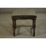 A country antique style oak stool with stuffover tapestry seat on stretchered barleytwist supports