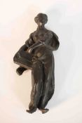 A 19th century bronze of a classical female figure holding a book. H.22 W.10 D.6cm.