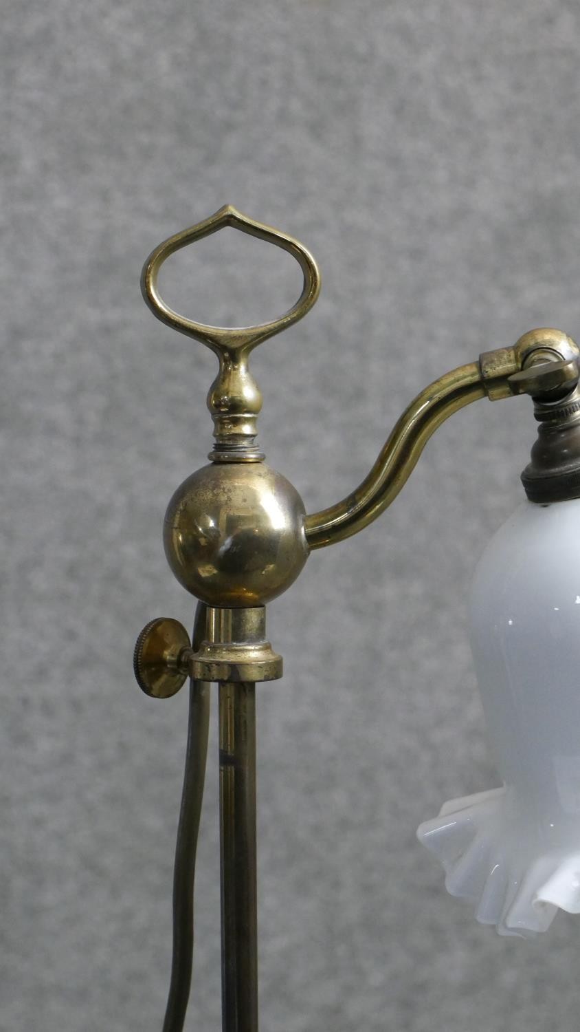An early 20th century brass student's lamp with handle on a moulded circular base. The bell form - Image 2 of 6