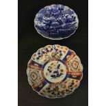 Two 19th century scalloped edged Japanese ceramic plates. One Imari style with stylised flowers