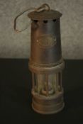 A Patterson Lamps Ltd Gateshead on Tyne miner's lamp. L.25 Dia.8cm.