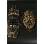 One ancestral mask from Papa New Guinea along with a painted and carved early 20th century African