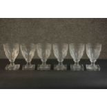 A set of six early 20th century hand cut petal faceted glass rummers with square bases. H.13.5 Dia.