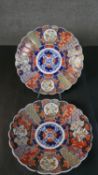 A pair of large 19th century hand painted Japanese Imari chargers. Decorated with floral and foliate