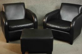 A pair of contemporary black leather armchairs, on tapering block feet, together with a matching
