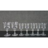 A collection of seven hand cut Waterford crystal wine and sherry glasses with star cut bases.