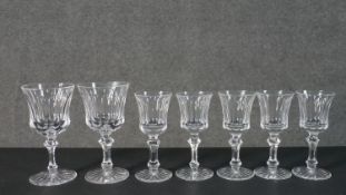 A collection of seven hand cut Waterford crystal wine and sherry glasses with star cut bases.