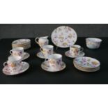 A ten person hand painted china pink and yellow rose pattern part tea set. Includes five cups and