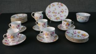 A ten person hand painted china pink and yellow rose pattern part tea set. Includes five cups and