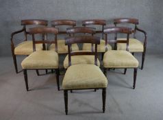 A set of eight Regency mahogany bar back dining chairs, comprising two carvers and six side