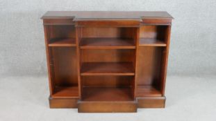 A Bradley George III style mahogany reproduction breakfront bookcase, the top with a moulded edge
