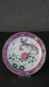 A 19th century Chinese Qing period Famille Rose hand painted porcelain plate with phoenix and