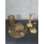 An early 20th century engraved brass smoking set along with a pair of brass candlesticks. H.5.5