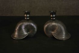 Becara, Madrid, a pair of cast silvered metal candlesticks in the form of nautilus shells, maker's