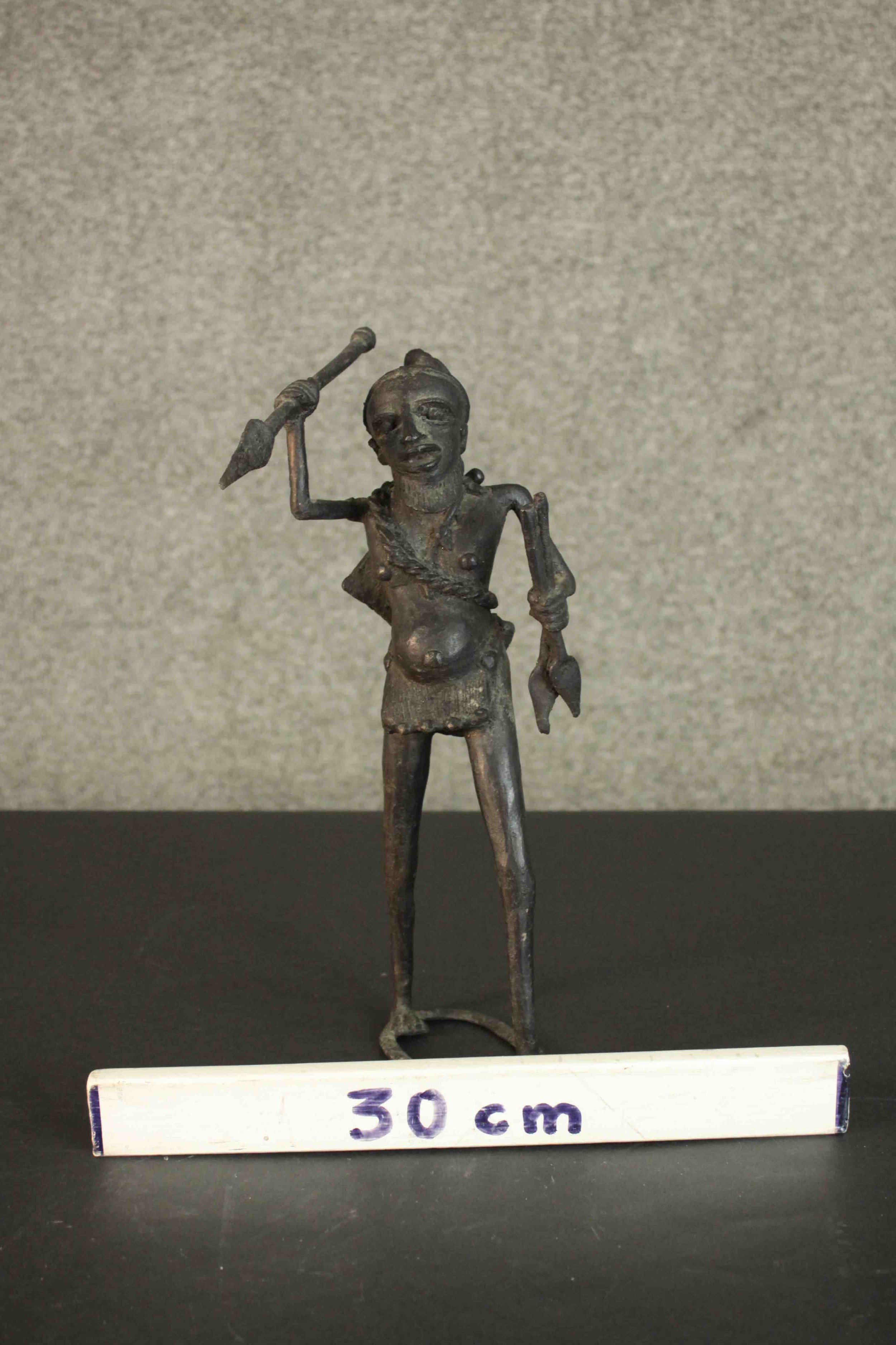 An African tribal bronze figure of a warrior throwing a spear. H.31 W.12cm - Image 2 of 7