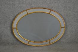 A 19th century Venetian style oval wall mirror with rope design border. H.81 W.60cm
