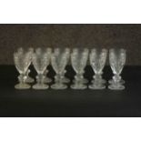 A set of twelve hand cut Baccarat crystal sherry glasses with laurel leaf design and star cut bases,