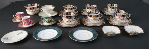 A collection of porcelain, including a St Michael six person tea set with swag and floral design,