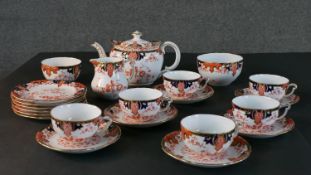 A Royal Crown Derby hand painted six person 'Imari Fern' pattern tea set. Maker's mark to base. (