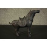 A 20th century Chinese archaistic style bronze horse. H.20.5 W.23 D.9cm.