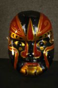 A large hand painted papier mache Japanese Kabuki mask. H.38 W.28cm.