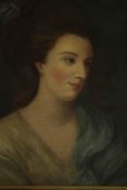 A 19th century carved giltwood framed oil on canvas portrait of a lady in a blue dress, unsigned.