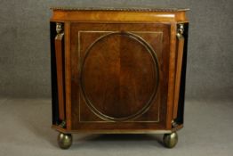 A circa 1810 Regency rosewood and satinwood corner cabinet, the rosewood top crossbanded in
