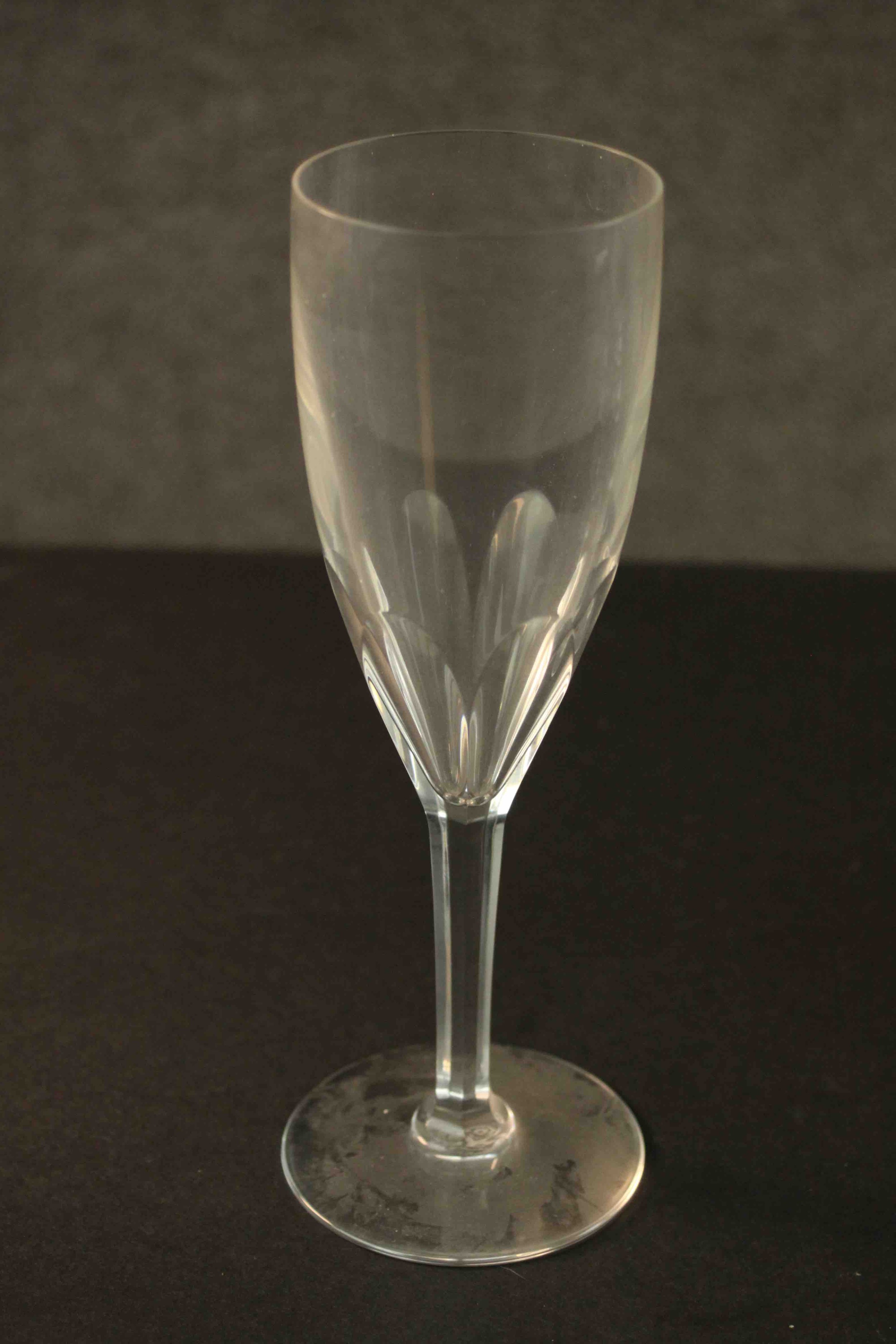 A set of twelve hand cut Baccarat crystal petal faceted champagne flutes, etched maker's stamp to - Image 3 of 4