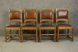 A set of four early 20th century oak dining chairs in the country antique style with leather backs
