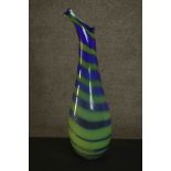 A large Murano style blue and green striped art glass vase. Signed to the base. H.74 W.21 D.15cm.