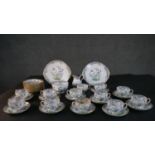 A twelve person hand painted Minton Emperor's Garden pattern part tea set. Makers mark to the