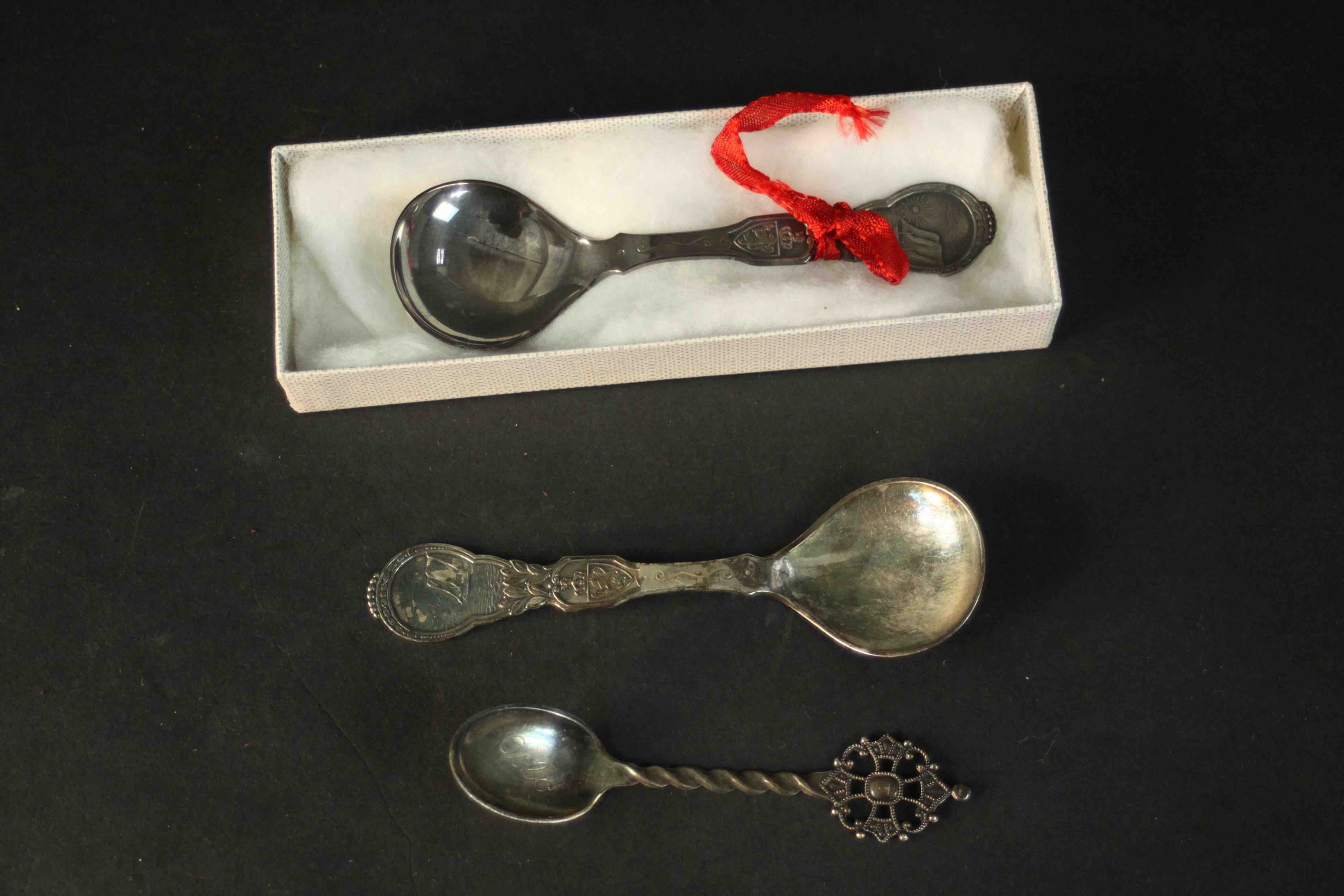 Three Norwegian silver spoons. One in box with sailing ship design. Stamped 800 with makers marks.