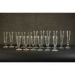 A collection of seventeen stemmed hand cut petal faceted glasses, including a set of six large