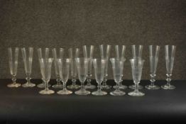 A collection of seventeen stemmed hand cut petal faceted glasses, including a set of six large