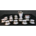 A collection of hand painted porcelain, including a set of twelve hand painted black and gold
