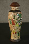 A Chinese early 20th century hand painted crackle glaze vase with turned lid. Decorated with