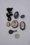 A collection of antique jewellery, including a micro mosaic brooch of a lute, a carved bone stag